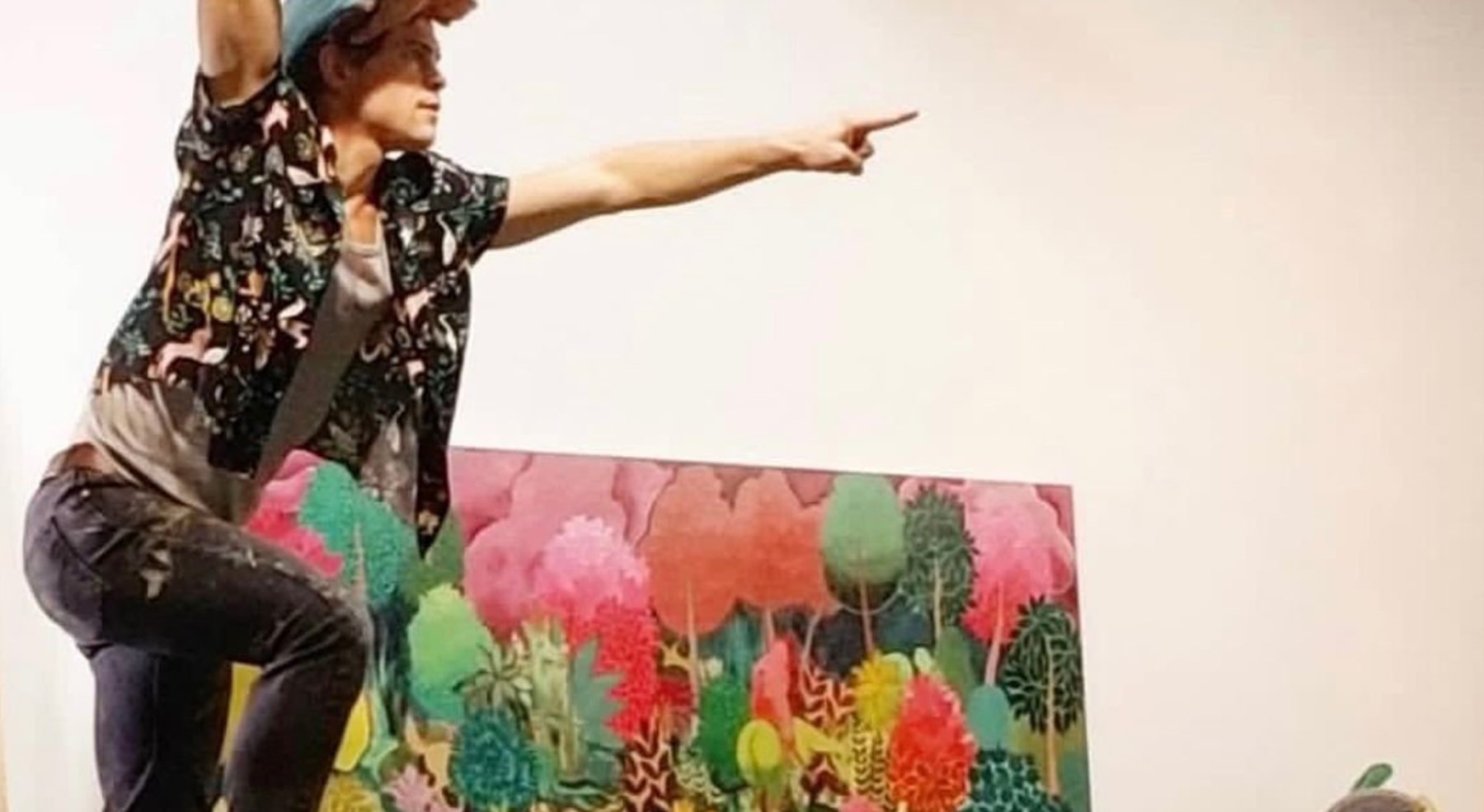 person on ladder over picture