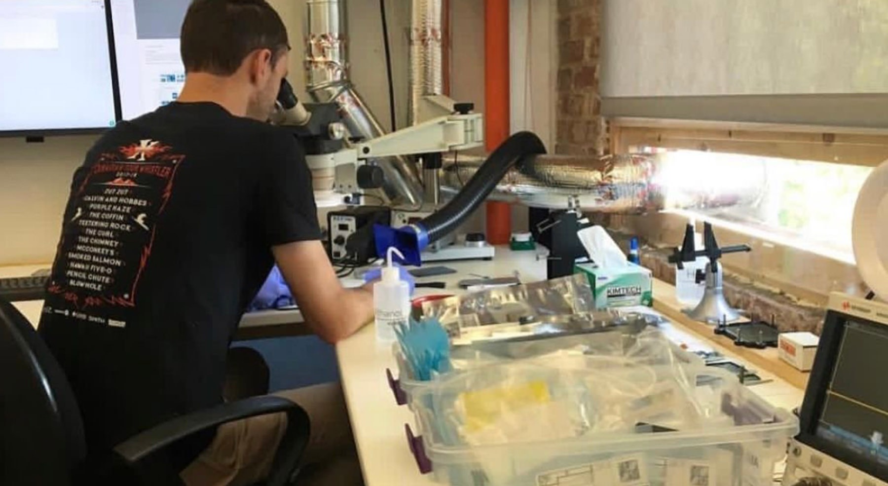 man drawing at table