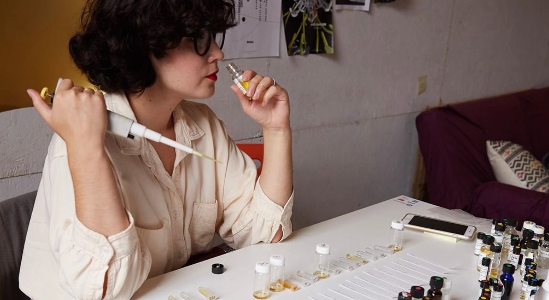 woman smelling bottle