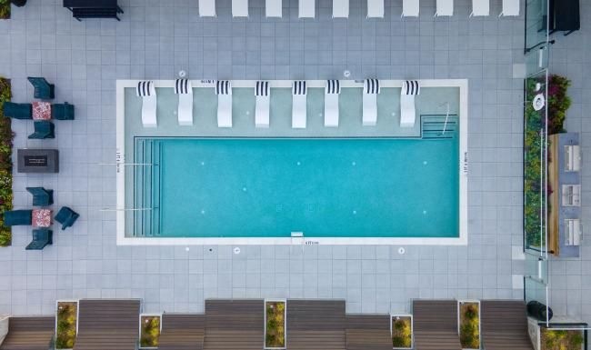 aerial of a pool with reclining seating