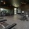 a gym with weights and moody-colored interiors
