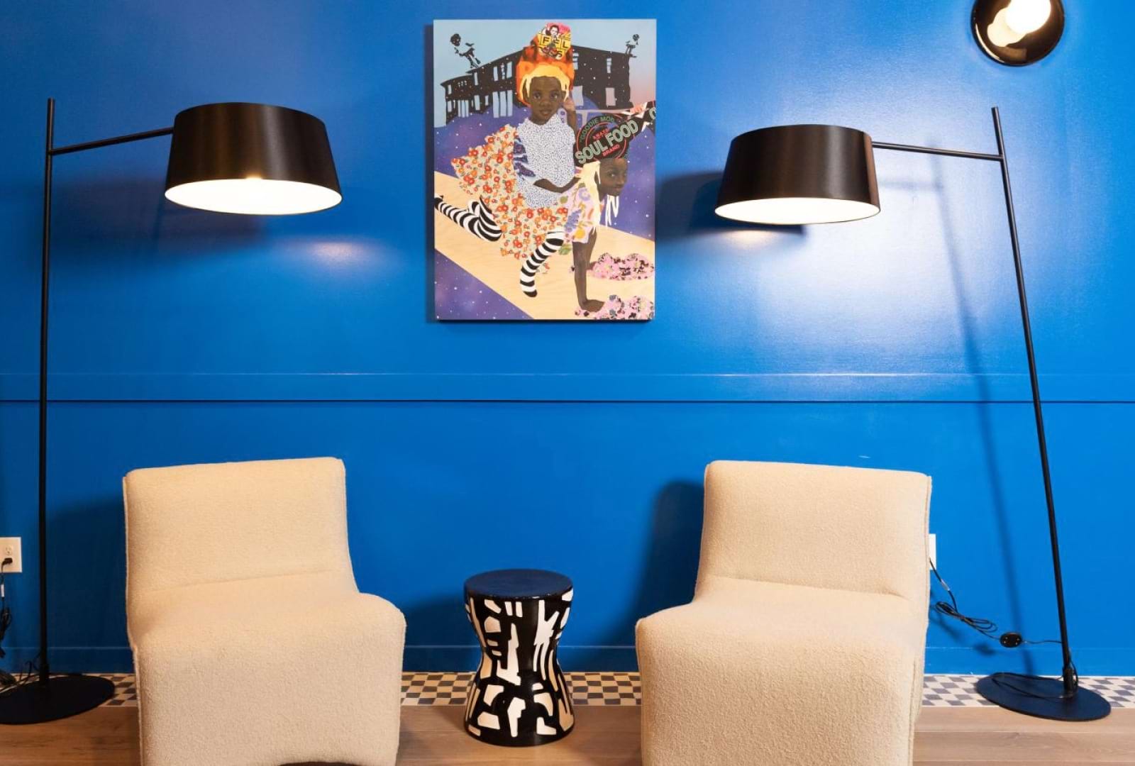 a room with a blue wall and chairs