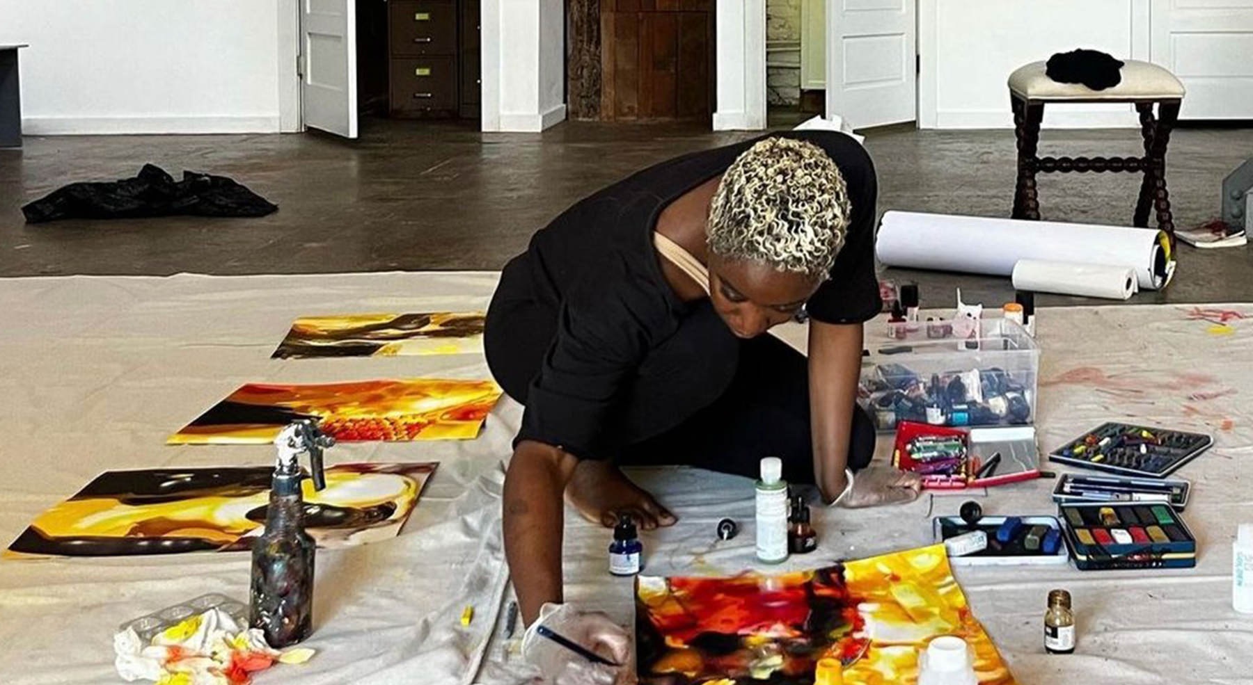 woman painting on floor