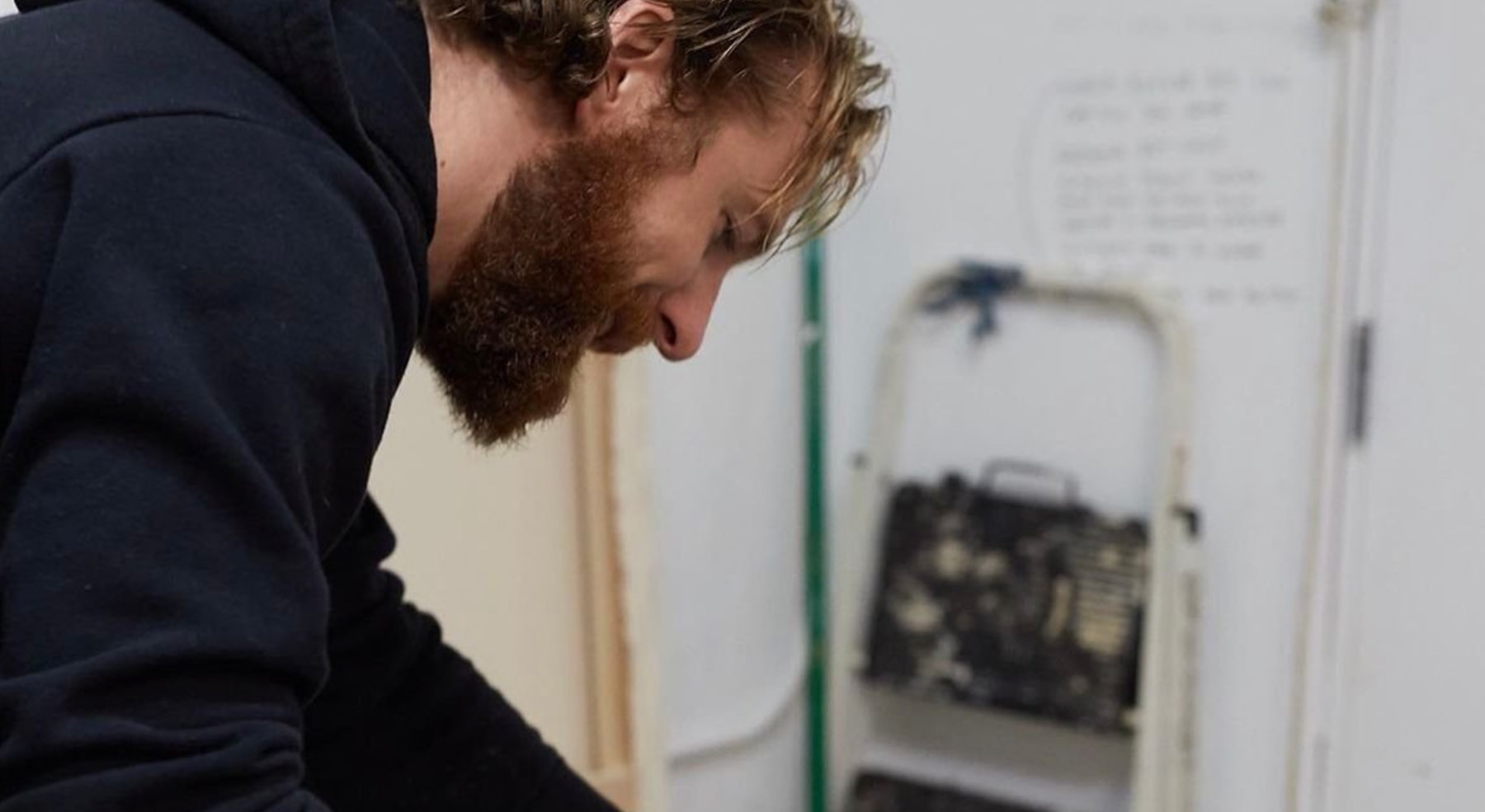 man looking at a ladder