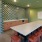 a room with a table and chairs